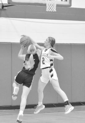 Asa Starr drives down for the layup and draws the foul during Arcadia Loup City on Tuesday, Jan. 16. (Courier photo by Patti Schwarz)
