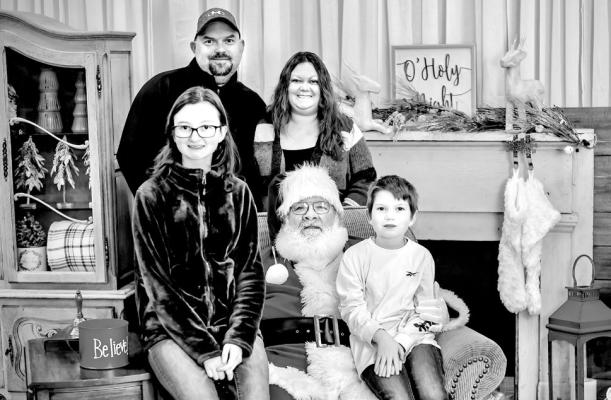 New Syndicate sports editor Dan Dunmire is pictured with his family; wife, Brandy-Jo, step-daughter Kaylee Webster and son Aidan.