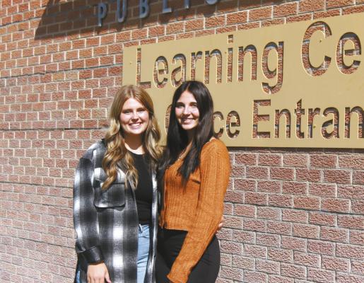 Maggie Birkel, left, and Jazlyn Bechtold are hosting a Breast Cancer Awareness 5K on Oct. 21 in Callaway. The event will serve as the girls’ FCCLA Star Project and will raise funds for a Callaway woman recently diagnosed with breast cancer. (Courier photo by Ellen Mortensen)