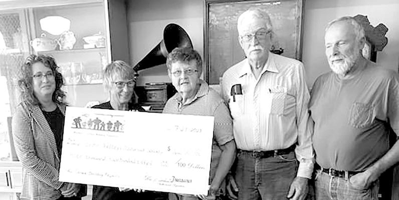 The Callaway Foundation presented a grant in the amount of $3,250 to the Seven Valley Historical Society on July 24. Pictured from left is: Kate Carlson with CCF, Chris Johnson, Jo and David Chesley, and Steve Miller with the Historical Society. The grant will be used to repair hail damages to the Historical Museum that weren’t covered by insurance. (Photo courtesy Christie Pitkin)