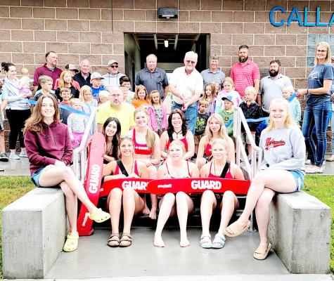 Lawrence Paulsen, center, cut the ribbon on the new Callaway swimming pool Saturday morning, June 1. Paulsen is the chair of the Village Pool Committee. He was joined by Chamber representatives, community members, and the new lifeguards. (Photo courtesy Rhonda McFate)