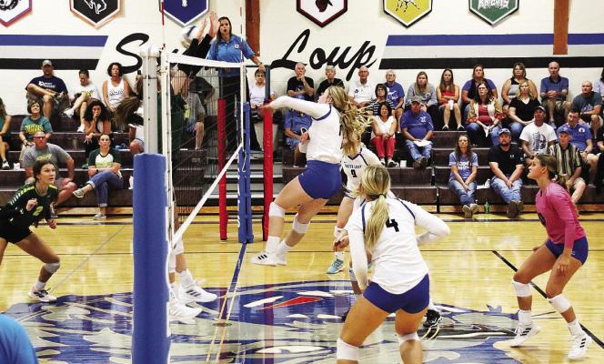 ABOVE: Senior Lauryn Johnson hits the ball against Kearney Catholic during the varsity matchup on Sept. 6 in Callaway. BELOW: Angel Johnson hits the ball during the JV game against Kearney Catholic on Sept. 6 in Callaway. Courier photos by Amanda Wehnes