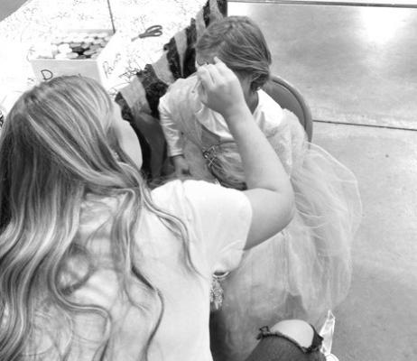 Face painting is just one of the activities at the annual Kids Fall Carnival that volunteers help out with. (Courier photo by Josie Reiff)