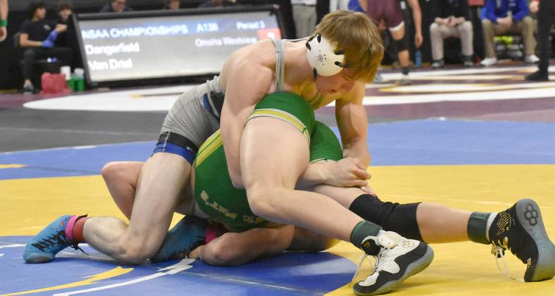Above: CJ Quandt tries to get his hands locked and get his St Pat’s opponent rolled over in first-round action at Omaha last week. Quandt lost the match in overtime.