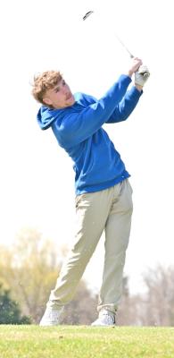 Senior Harper Johnson watches to see where his ball landed at the team’s second meet of the season at Amherst on April 3. (Photo courtesy Jessica Tickle)