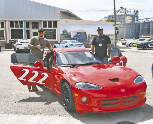 Driver Timothy Bayer of Bennington, and his navigator Alex Bayer, pose with their 2001 Dodge Viper GTS in Callaway following the shootout. Unfortunately the team didn't have the results they wanted but they still enjoyed the weekend. (Courier photo by Leta Connell)