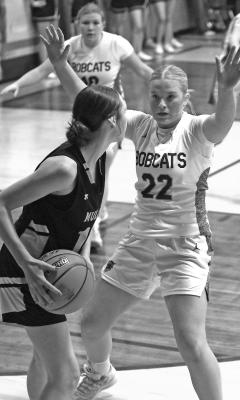 Neltje Reiff puts pressure on a Mullen ball handler during last week’s game. (Courier photos by Ronda McFate)