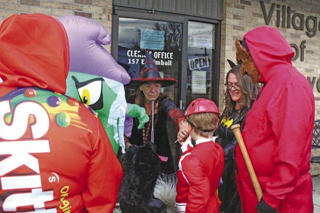 Callaway Village Clerk Lori Bonde was anything but “wicked” as she handed out treats to the kiddos – and even had one for their dog!