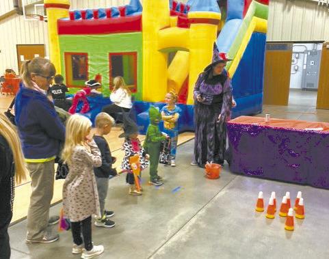 A variety of kids games, and a bounce house provided by the Oconto Fire Department, are some of the highlights at the annual Fall Kids Carnival in Callaway held this past Saturday. (Courier photo by Josie Reiff)