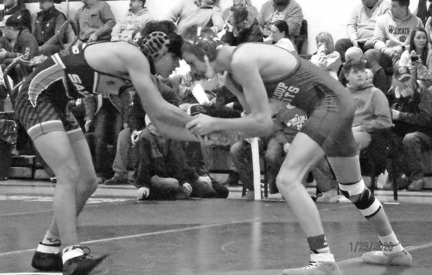 Noah Hiatt grapples with an opponent from Sutherland.