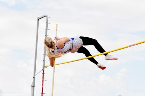 Bryn Schwarz won the Dave Blevins Invite with not one PR but two in the pole vault - first clearing the bar at 8' 6 then at an even 9'. (Courier photo by Loleta Connell)