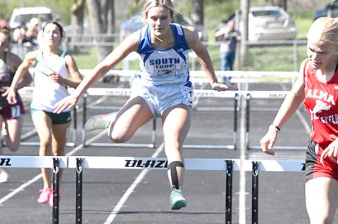 Charli Vickers crosses the last hurdle in second place to earn a trip to Burke Stadium in the 300 hurdles.
